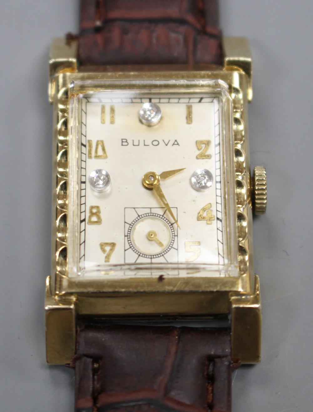 A gentlemans 1940s Art Deco 10k gold filled Bulova rectangular manual wind wrist watch,